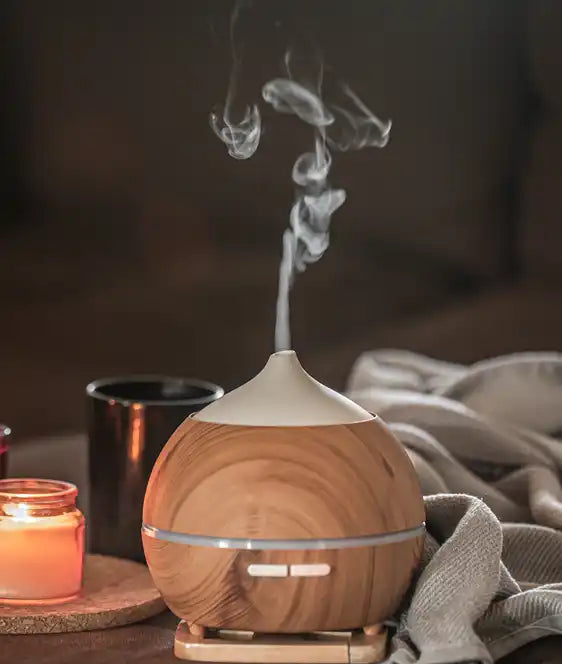 oil-diffuser-blurred-space-near-burning-candles-aromatherapy-health-care-concept.webp