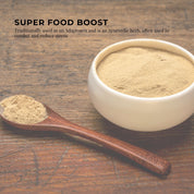 Light brown Organic Ashwagandha Root Powder in a bowl with a wooden spoon