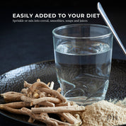 Dried Organic Ashwagandha Root and Powder Withania Somnifera Next to a Glass of Water