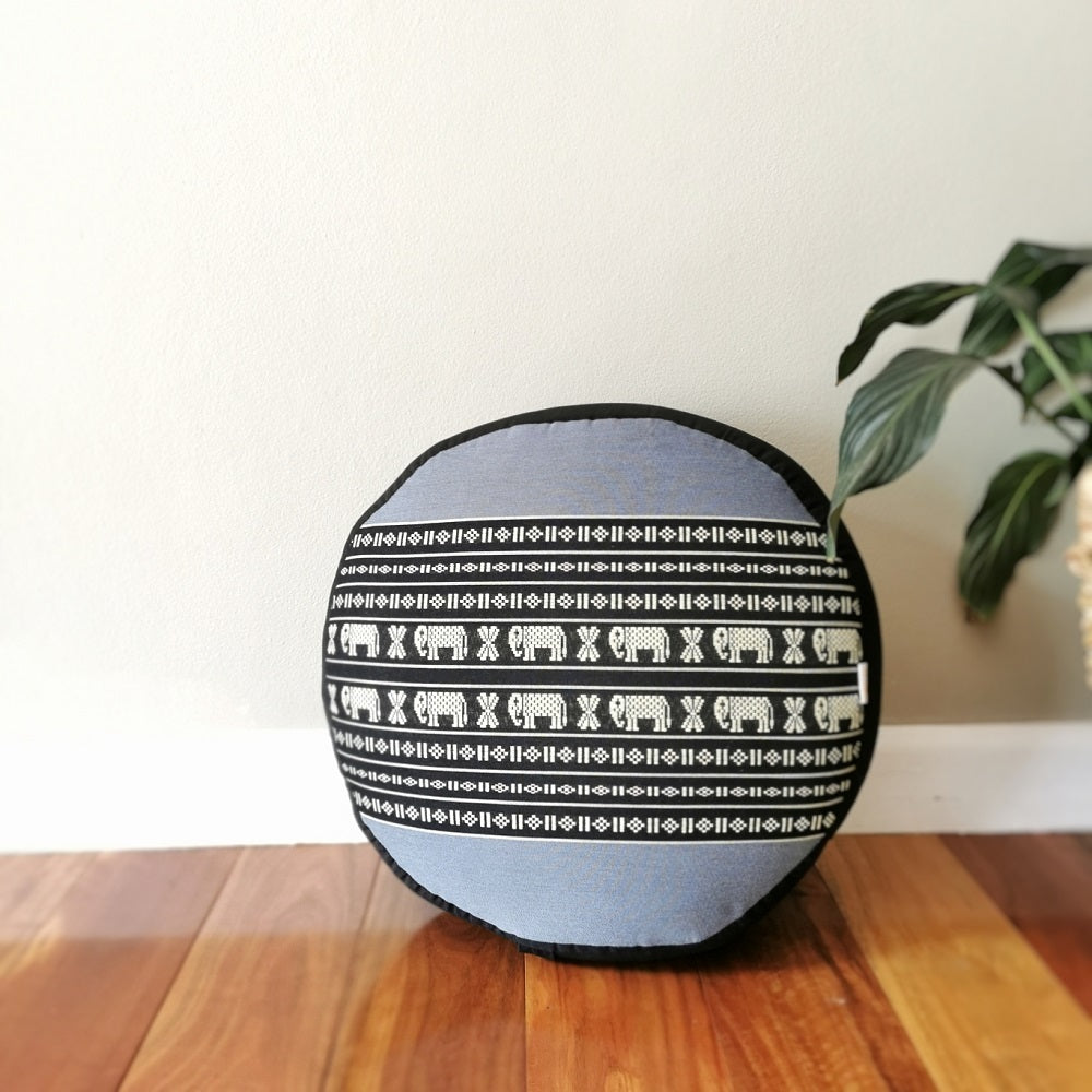 blue and black round meditation cushion with thai elephant pattern