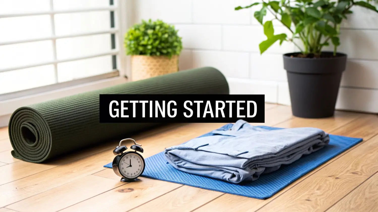 A rolled green yoga mat, folded light blue clothing, and an alarm clock on a wooden floor, with a text overlay 'GETTING STARTED'.