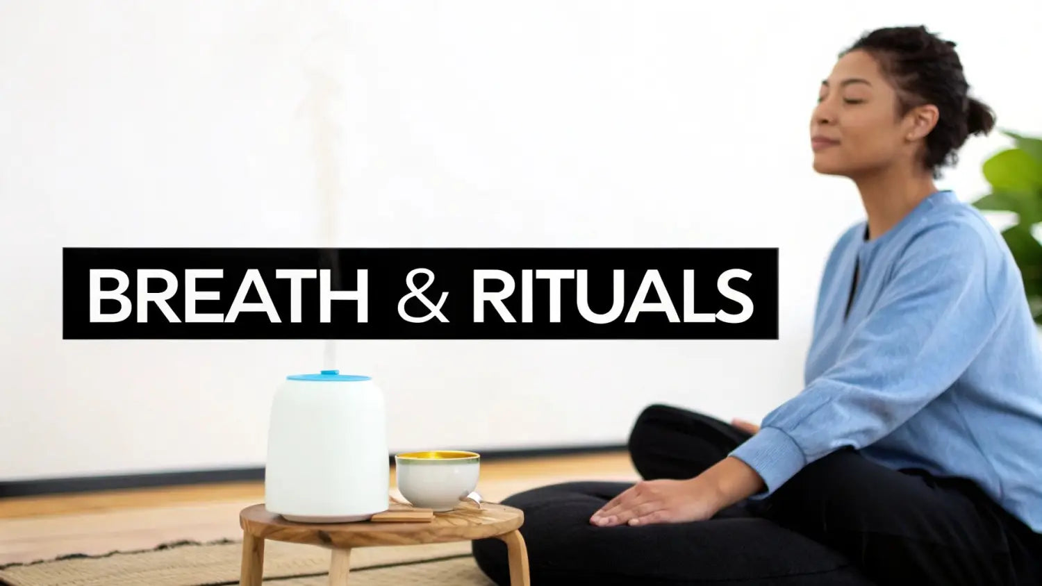 A serene woman meditating with an essential oil diffuser and tea, promoting breath and rituals.